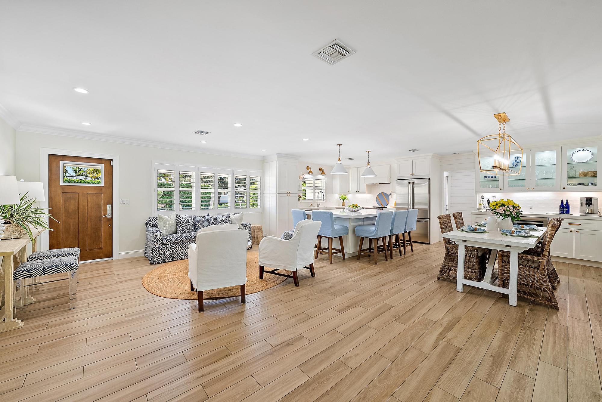 4967 Bimini Road Tequesta, FL 33469 - Photo 22 of 36 a living room with furniture and wooden floor