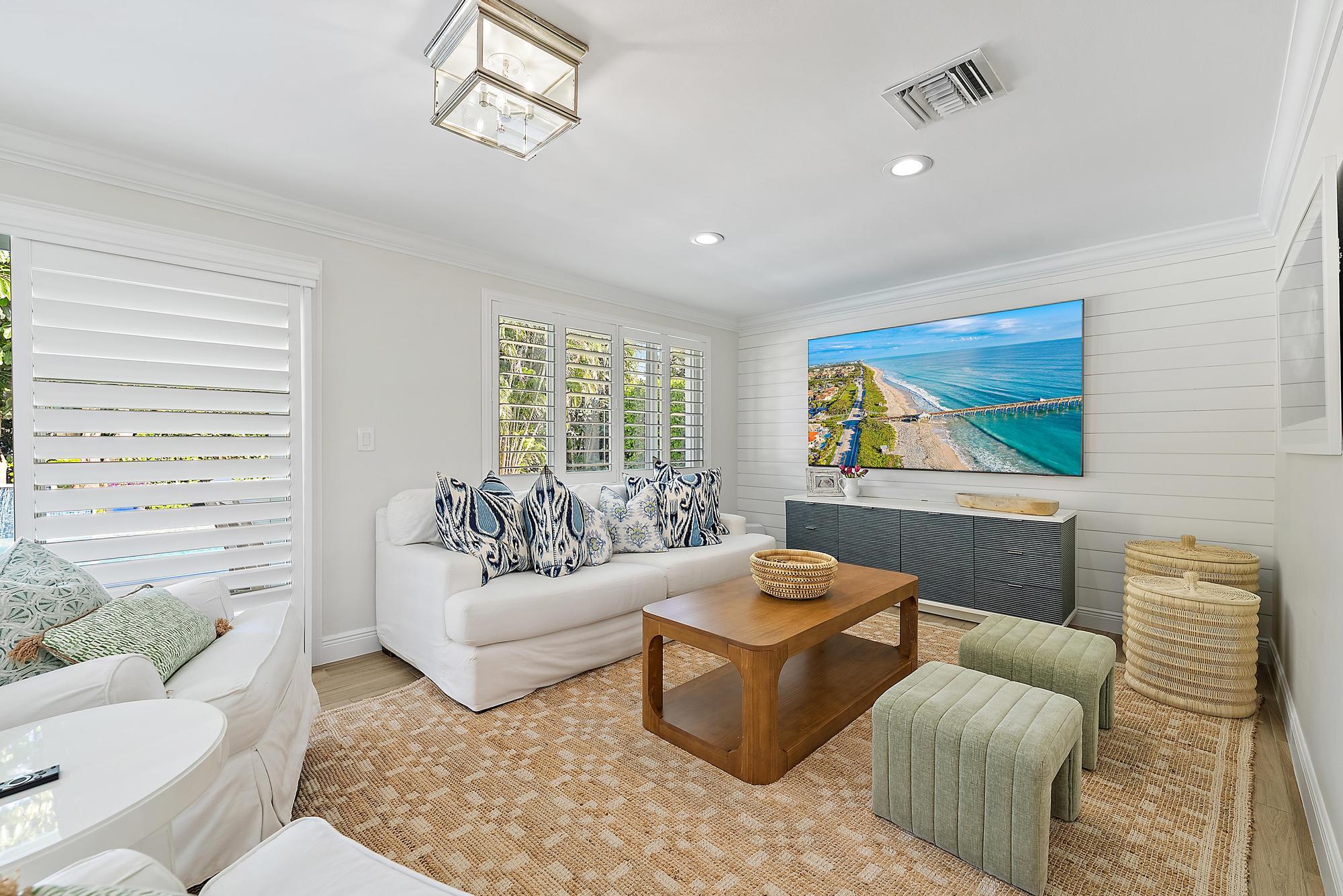 4967 Bimini Road Tequesta, FL 33469 - Photo 23 of 36 a living room with furniture and a flat screen tv