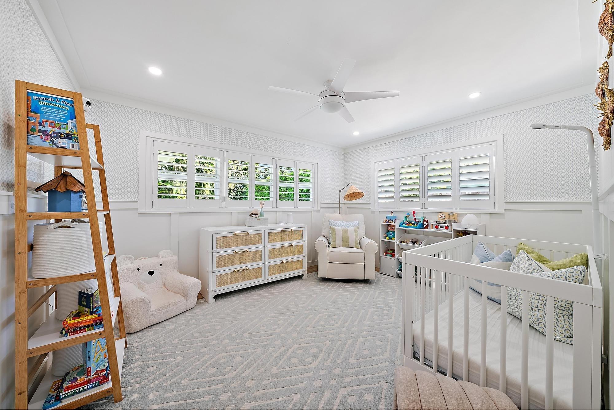 4967 Bimini Road Tequesta, FL 33469 - Photo 26 of 36 a bedroom with furniture and a window