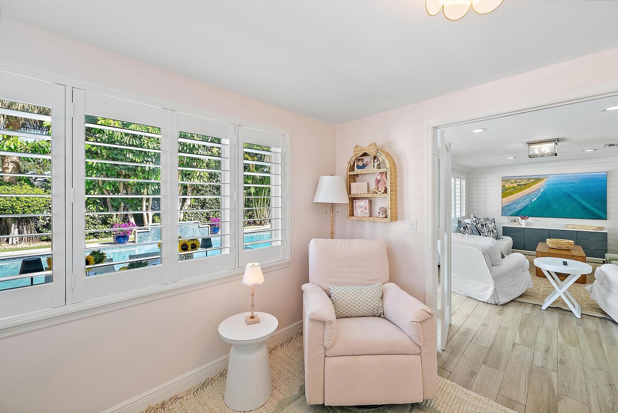 4967 Bimini Road Tequesta, FL 33469 - Photo 27 of 36 a living room with furniture and a large window