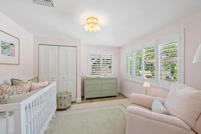 a bedroom with furniture and a window