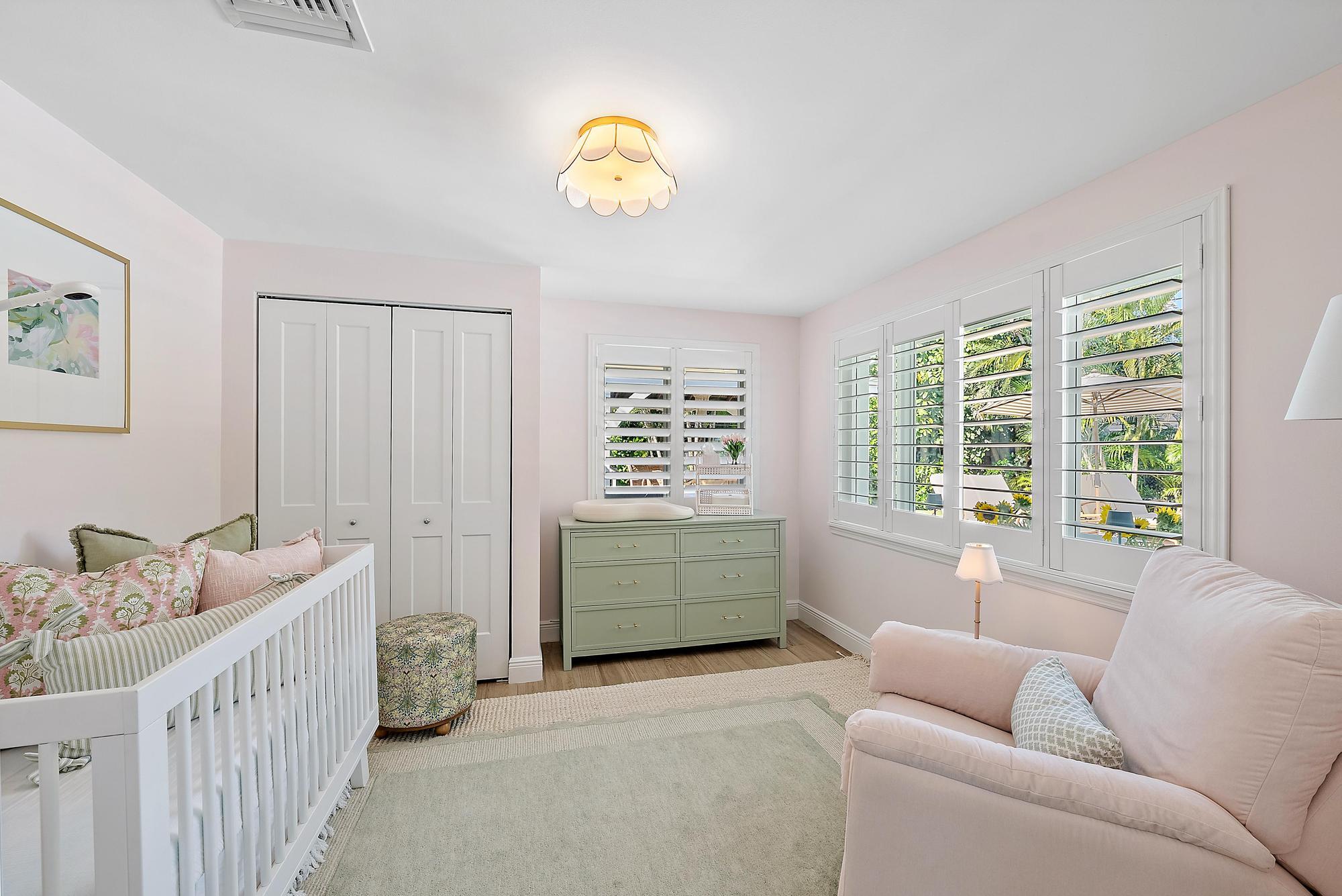 4967 Bimini Road Tequesta, FL 33469 - Photo 29 of 36 a bedroom with furniture and a window