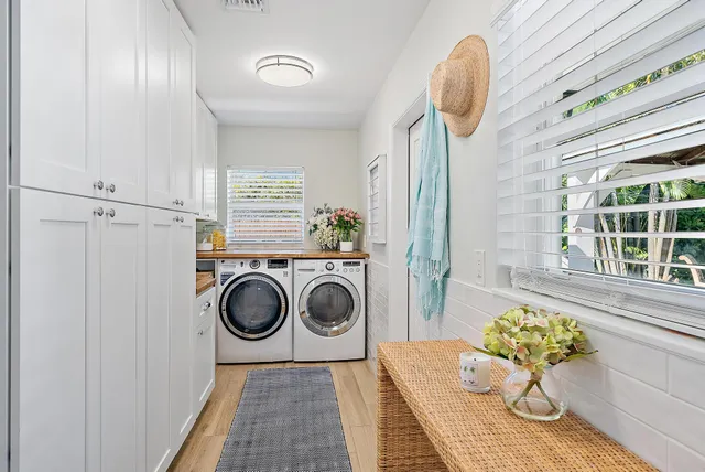 a bathroom with a sink mirror and window
