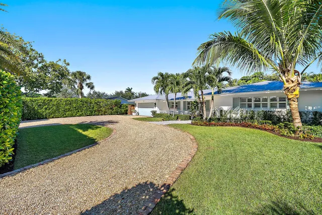 a view of yard with swimming pool and green space