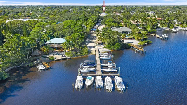 a view of balcony with seating space and trees in the background