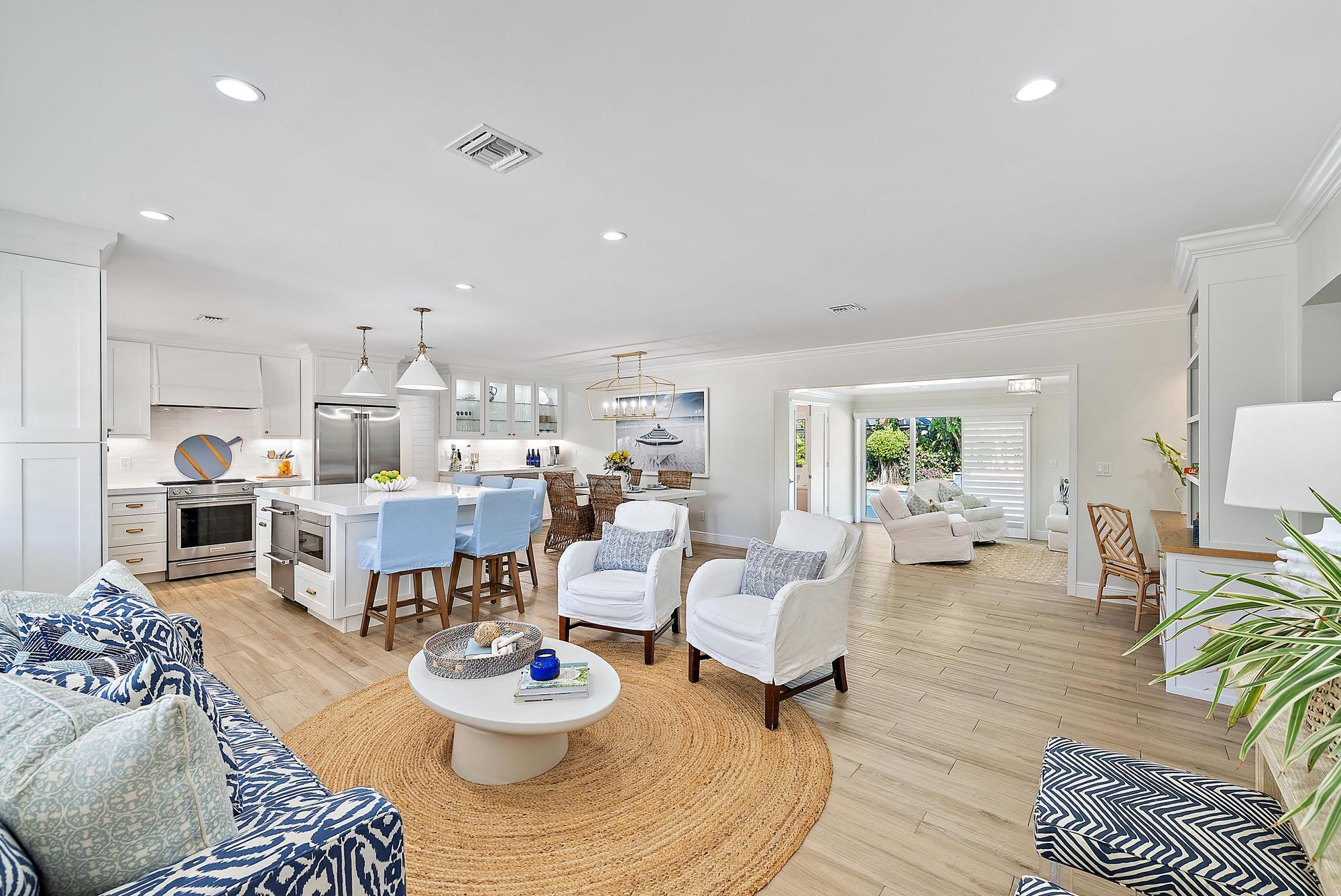 4967 Bimini Road Tequesta, FL 33469 - Photo 9 of 36 a living room with furniture kitchen view and a table