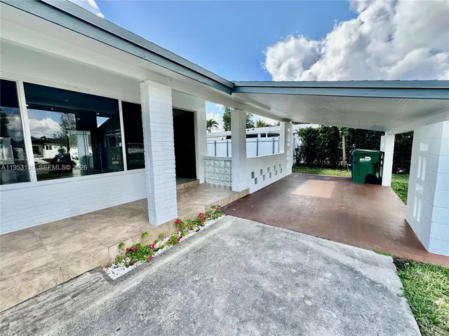 a view of a building with potted plants