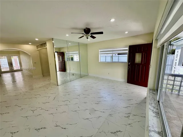 a view of a hallway with a chandelier