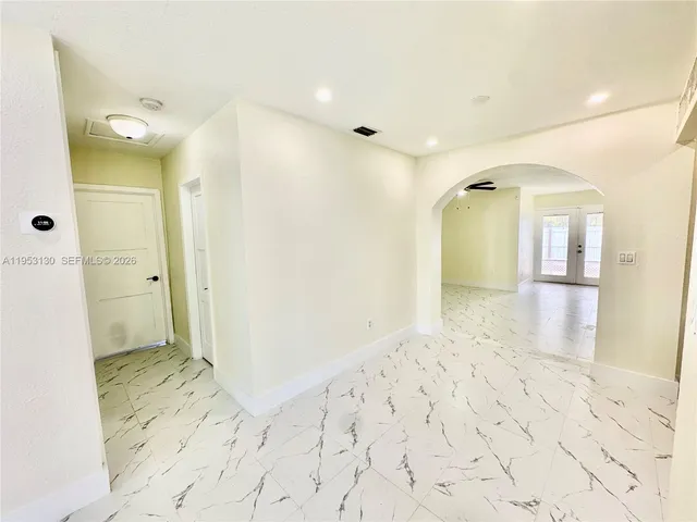 a view of a bathroom with a sink and a mirror