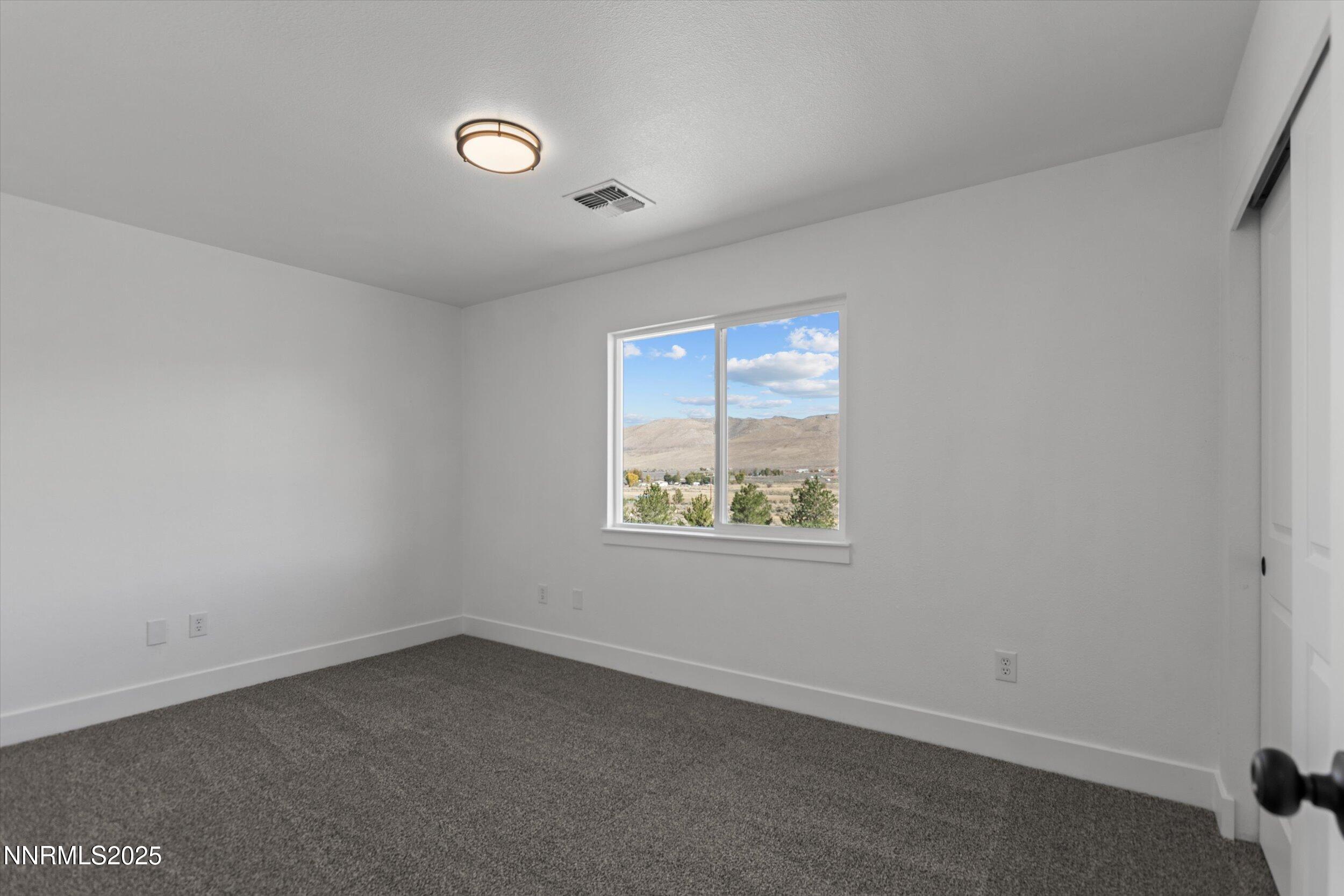 15205 North Red Rock Road Reno, NV 89508 - Photo 12 of 23 an empty room with windows