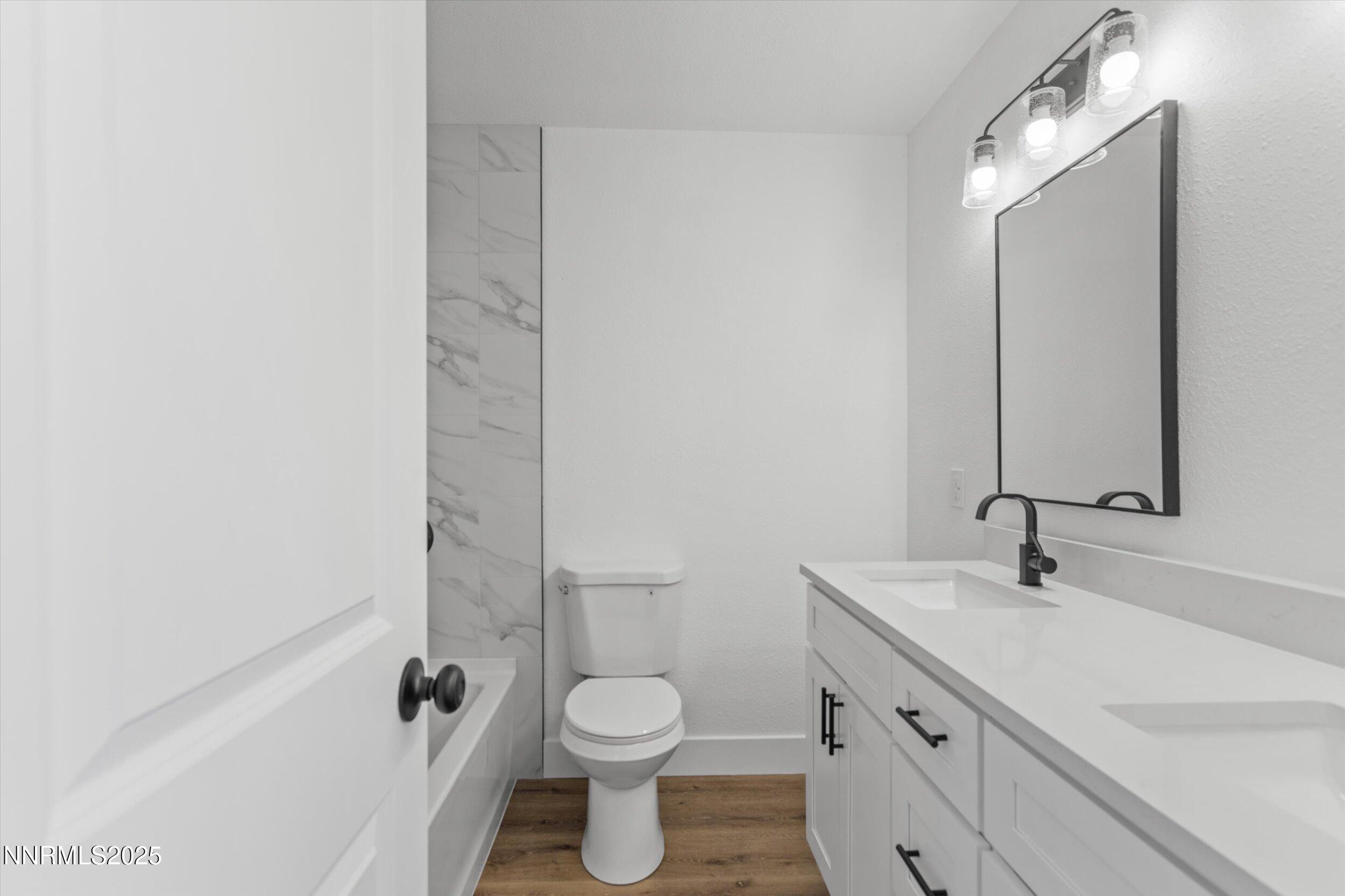 15205 North Red Rock Road Reno, NV 89508 - Photo 13 of 23 a bathroom with a sink and a mirror
