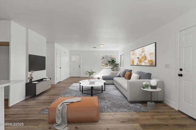 a kitchen with stainless steel appliances granite countertop a sink dishwasher a stove and a microwave oven with cabinets