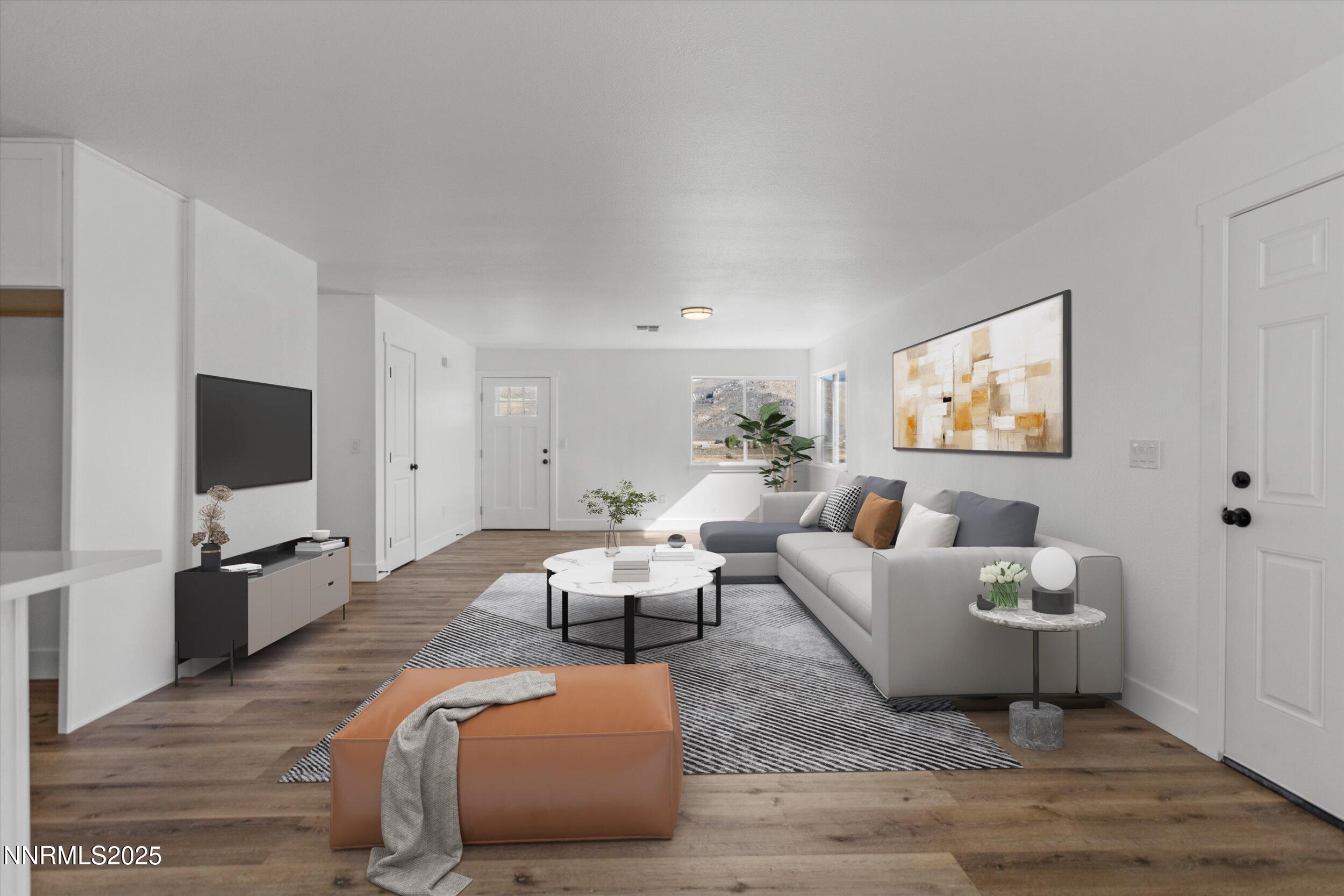 15205 North Red Rock Road Reno, NV 89508 - Photo 5 of 23 a living room with furniture a flat screen tv and a refrigerator