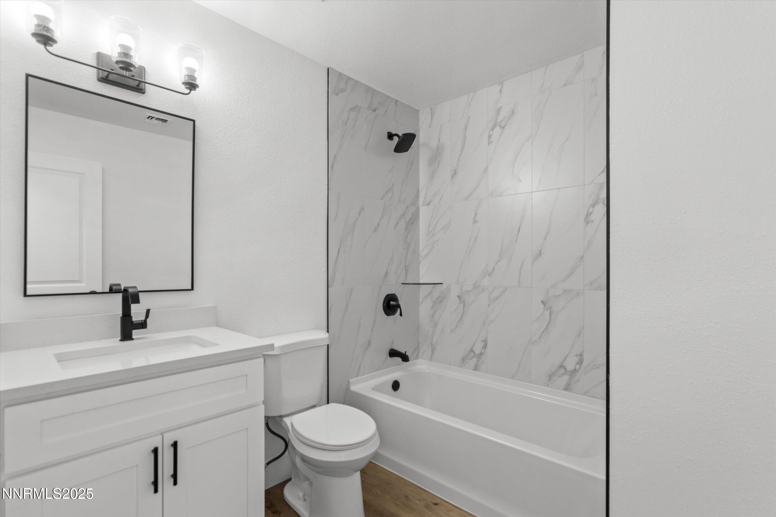 15205 North Red Rock Road Reno, NV 89508 - Photo 10 of 23 a bathroom with a sink toilet and shower