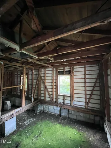 a view of room with window and a fireplace