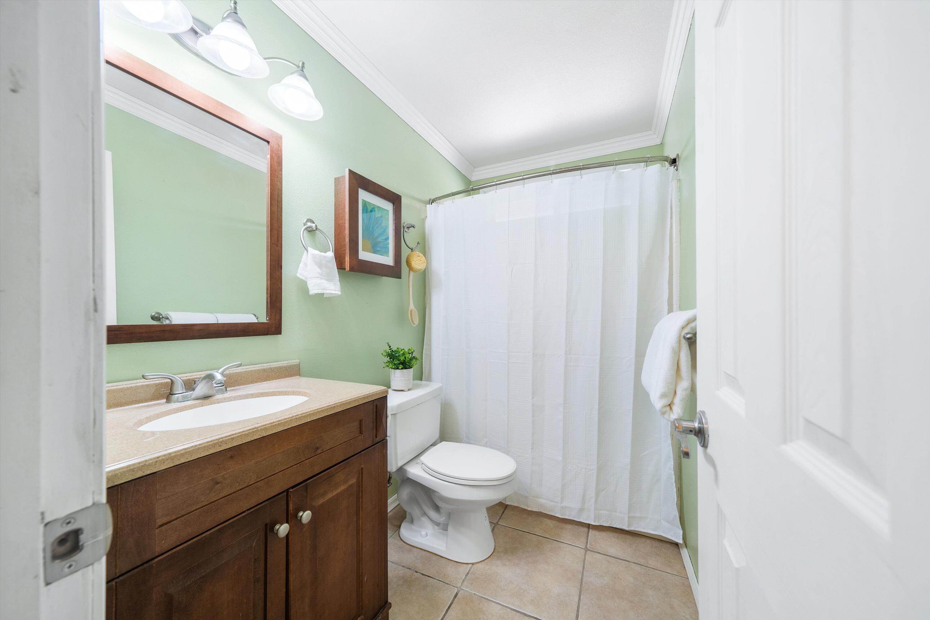 25801 Cumberland Road Tehachapi, CA 93561 - Photo 17 of 35 a bathroom with a double vanity sink toilet mirror and shower
