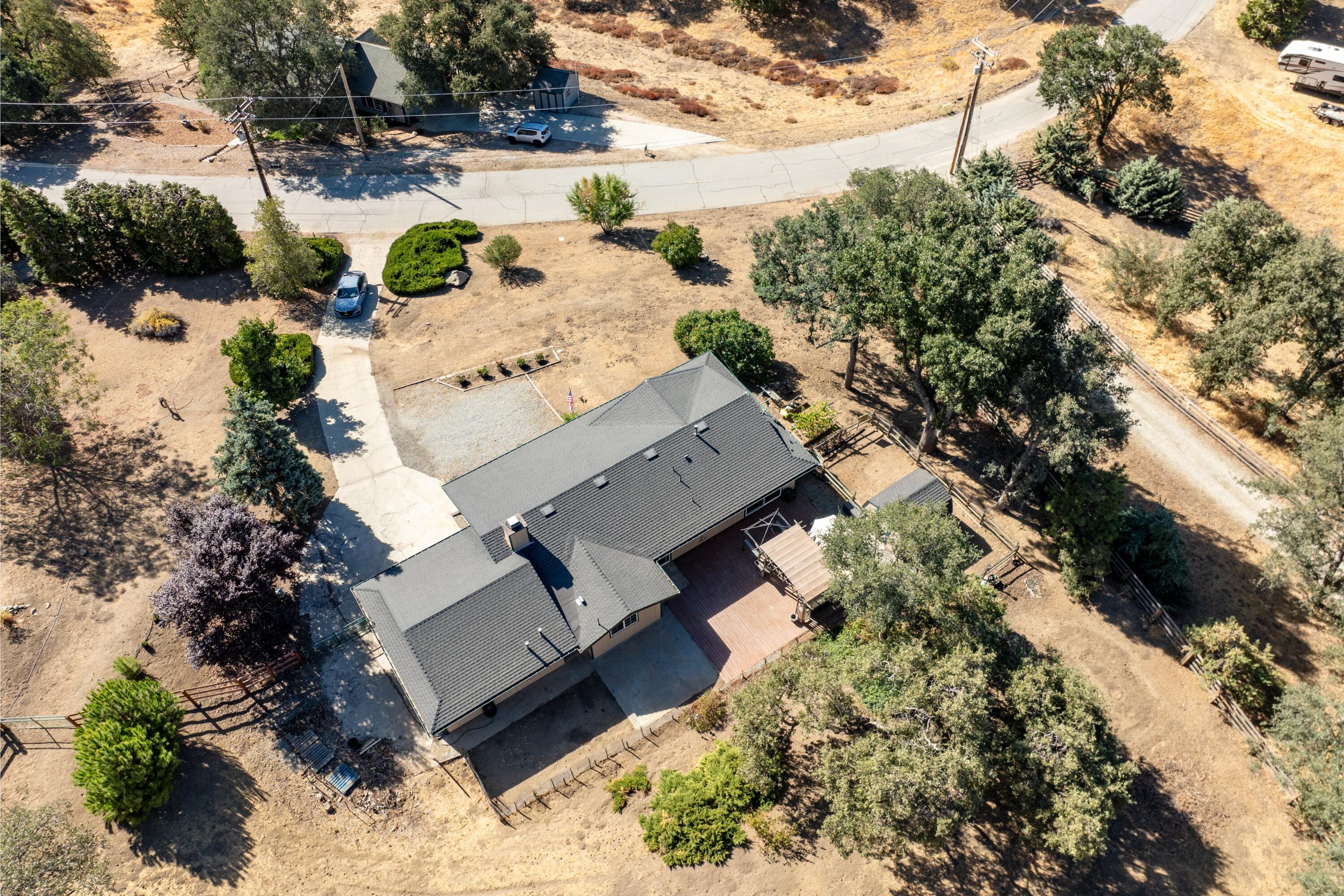 25801 Cumberland Road Tehachapi, CA 93561 - Photo 25 of 35 an aerial view of a house with a yard