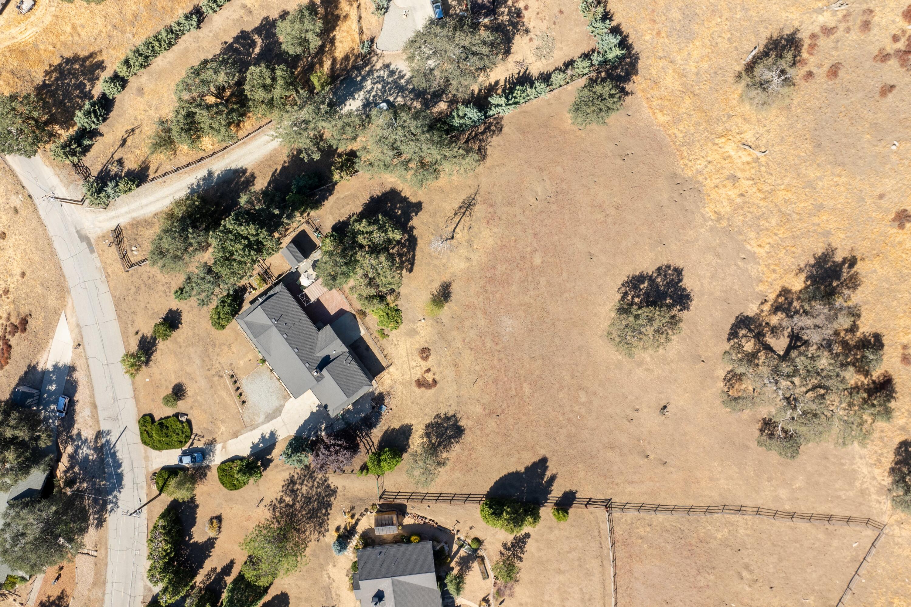 25801 Cumberland Road Tehachapi, CA 93561 - Photo 29 of 35 an aerial view of a house with a yard