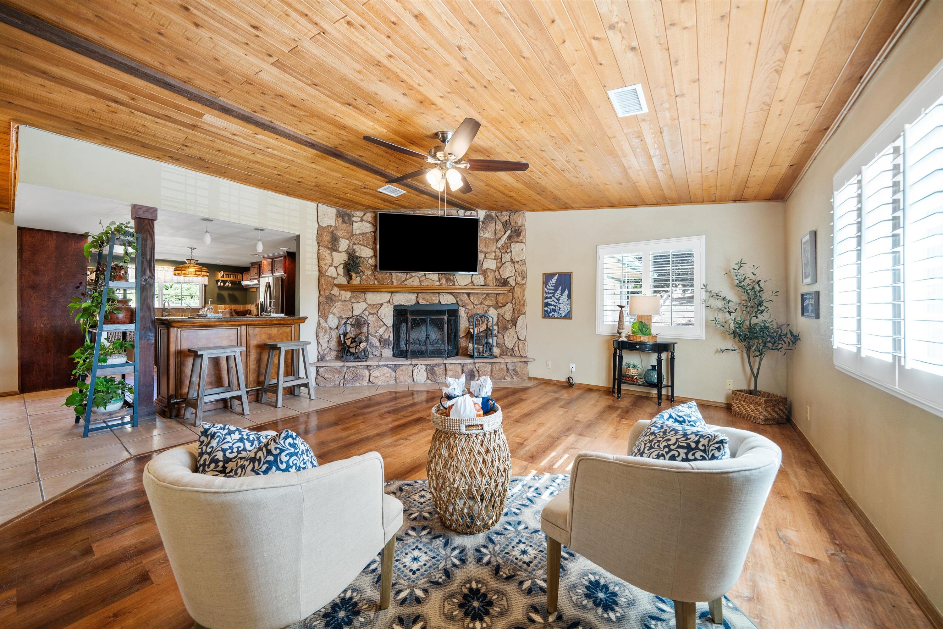 25801 Cumberland Road Tehachapi, CA 93561 - Photo 3 of 35 a living room with fireplace furniture and a flat screen tv