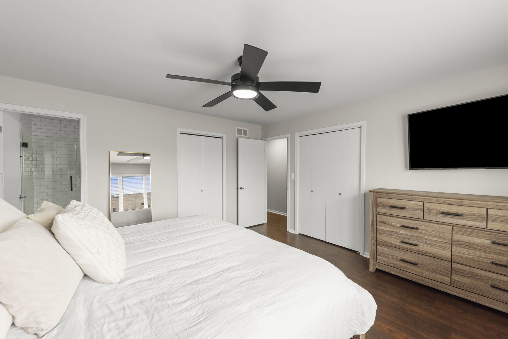 16505 Timberview Drive Plainfield, IL 60586 - Photo 13 of 29 a bedroom with a bed and a flat screen tv