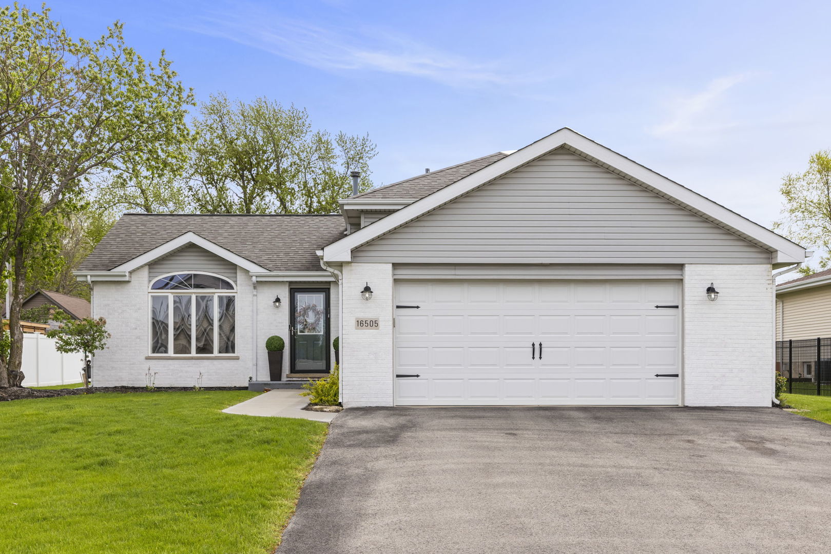 16505 Timberview Drive Plainfield, IL 60586 - Photo 2 of 29 a front view of a house with a yard and garage