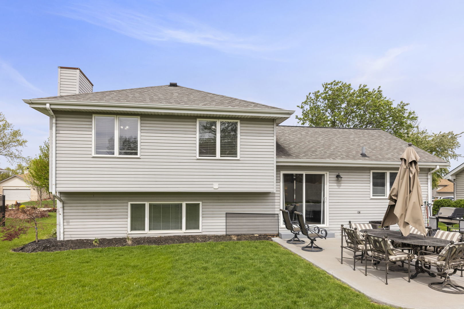 16505 Timberview Drive Plainfield, IL 60586 - Photo 25 of 29 a backyard of a house with table and chairs