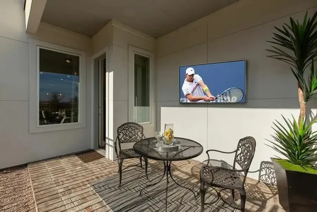 a dining room with furniture and window
