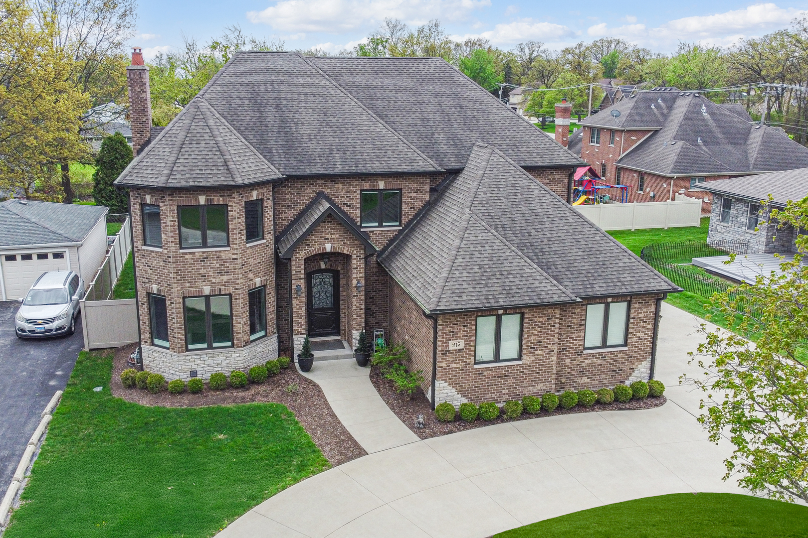 a aerial view of a house with garden and plants
