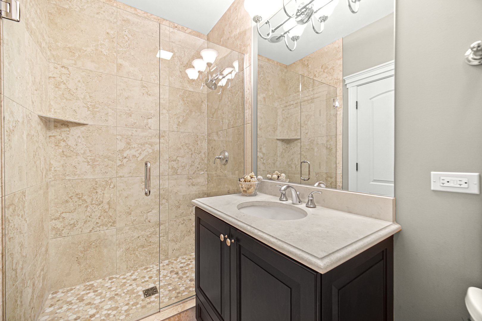 915 Forestview Road Addison, IL 60101 - Photo 18 of 49 a bathroom with a sink a mirror and a shower