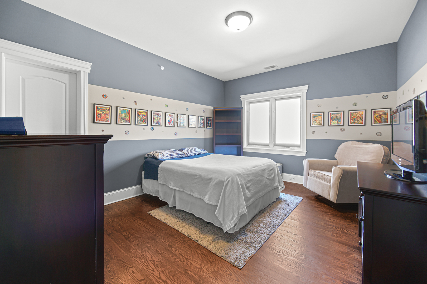 915 Forestview Road Addison, IL 60101 - Photo 22 of 49 a bedroom with a bed couch and a window