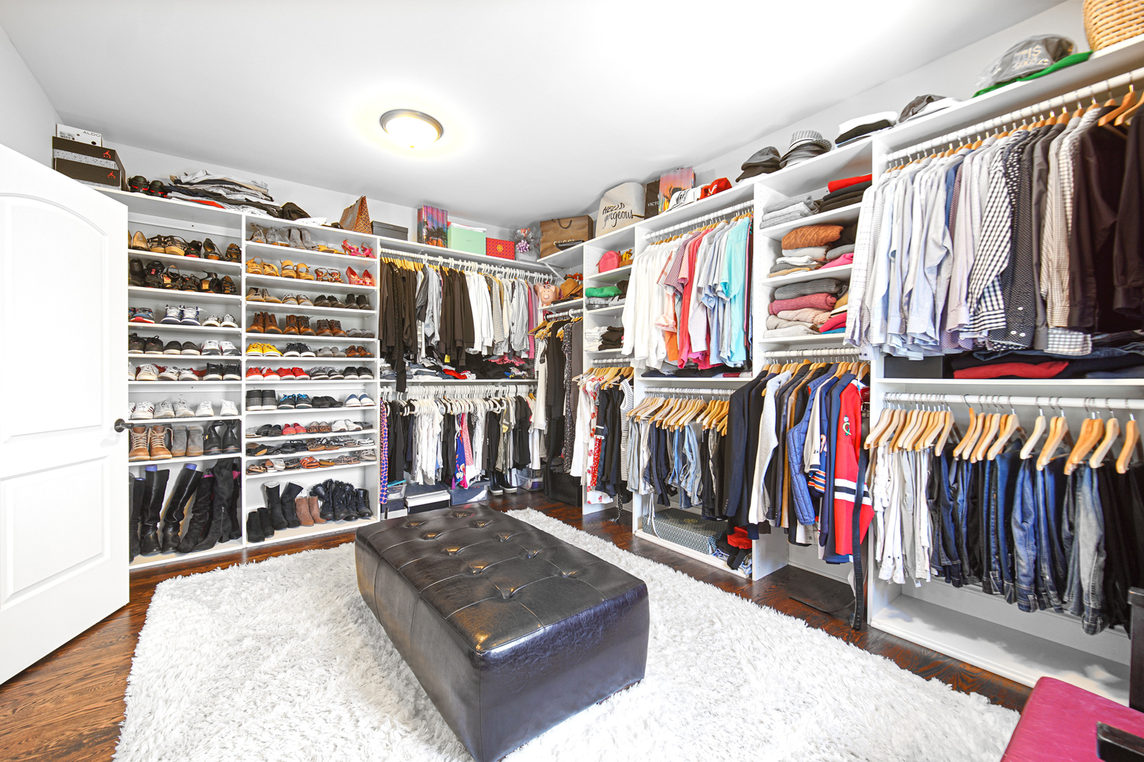 915 Forestview Road Addison, IL 60101 - Photo 30 of 49 a view of walk in closet with clothes and shoes