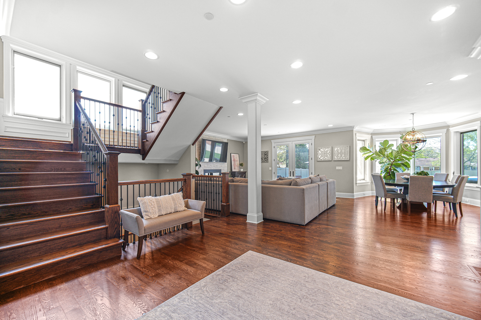 915 Forestview Road Addison, IL 60101 - Photo 5 of 49 a living room with furniture and a dining table with wooden floor