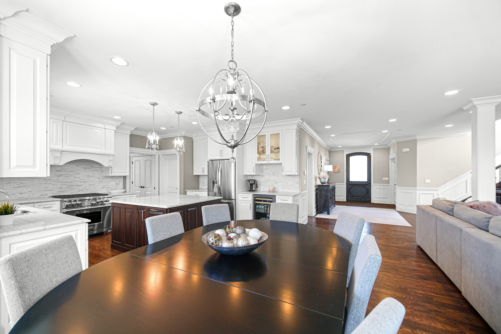 915 Forestview Road Addison, IL 60101 - Photo 10 of 49 a large kitchen with stainless steel appliances a stove a table and chairs