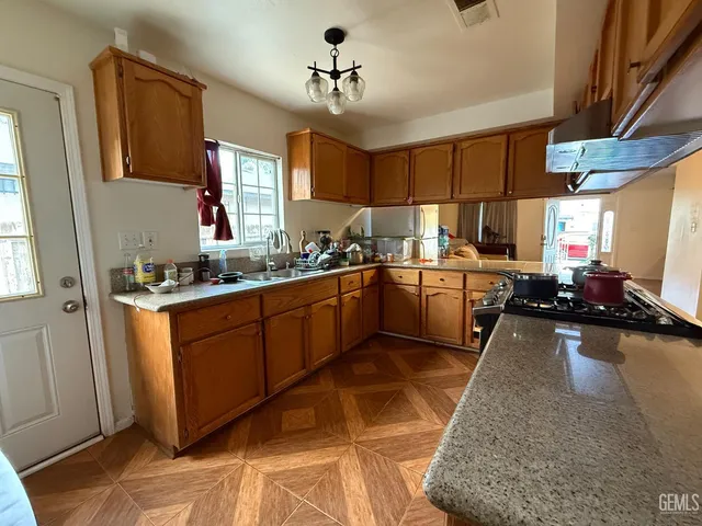 a kitchen with cabinets a sink and appliances