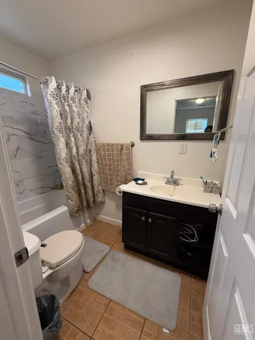 a room with a bed and furniture