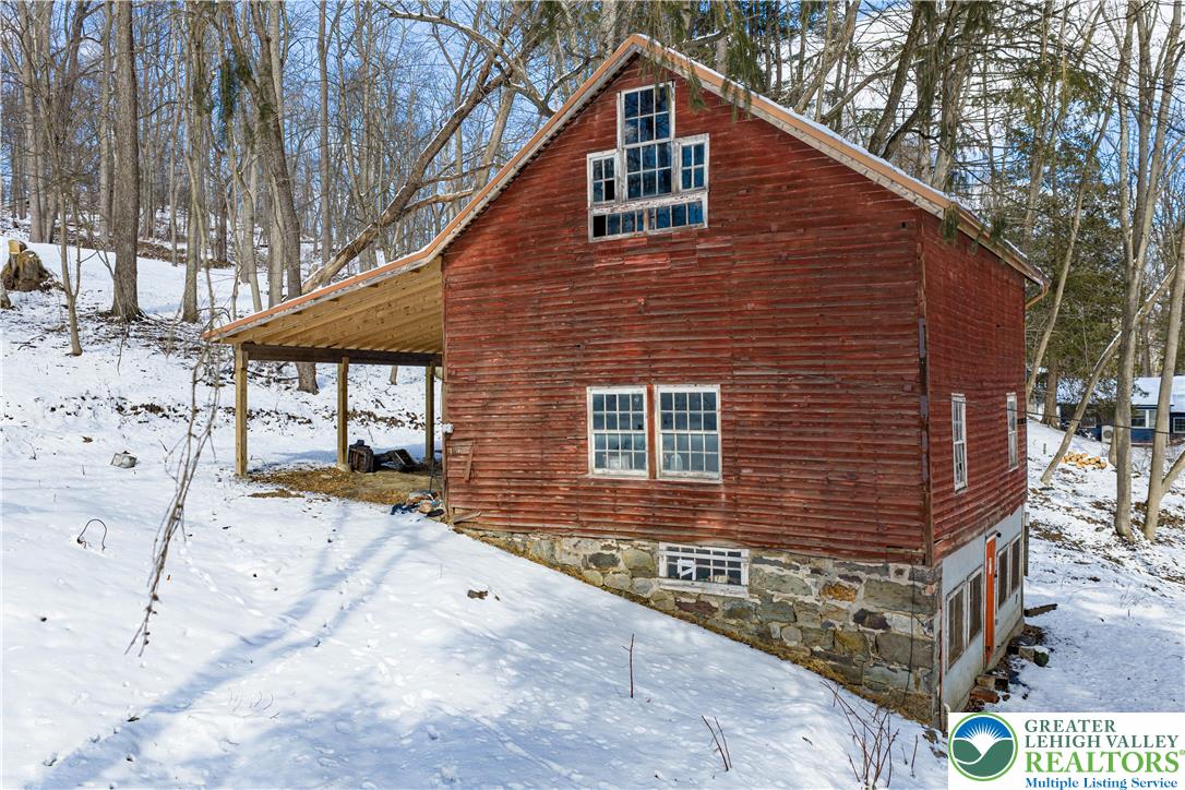 2058 River Road Mount Bethel, PA 18343 - Photo 11 of 39 a front view of a house with a yard