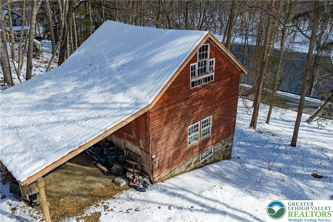 2058 River Road Mount Bethel, PA 18343 - Photo 12 of 39 a view of a wooden deck with two trees