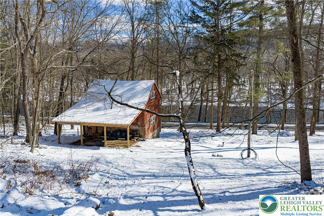 2058 River Road Mount Bethel, PA 18343 - Photo 14 of 39 a front view of a house with garden