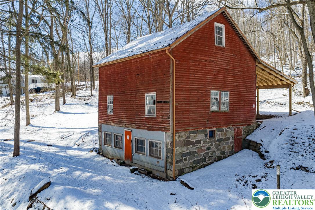 2058 River Road Mount Bethel, PA 18343 - Photo 17 of 39 a view of a house with a yard covered in snow