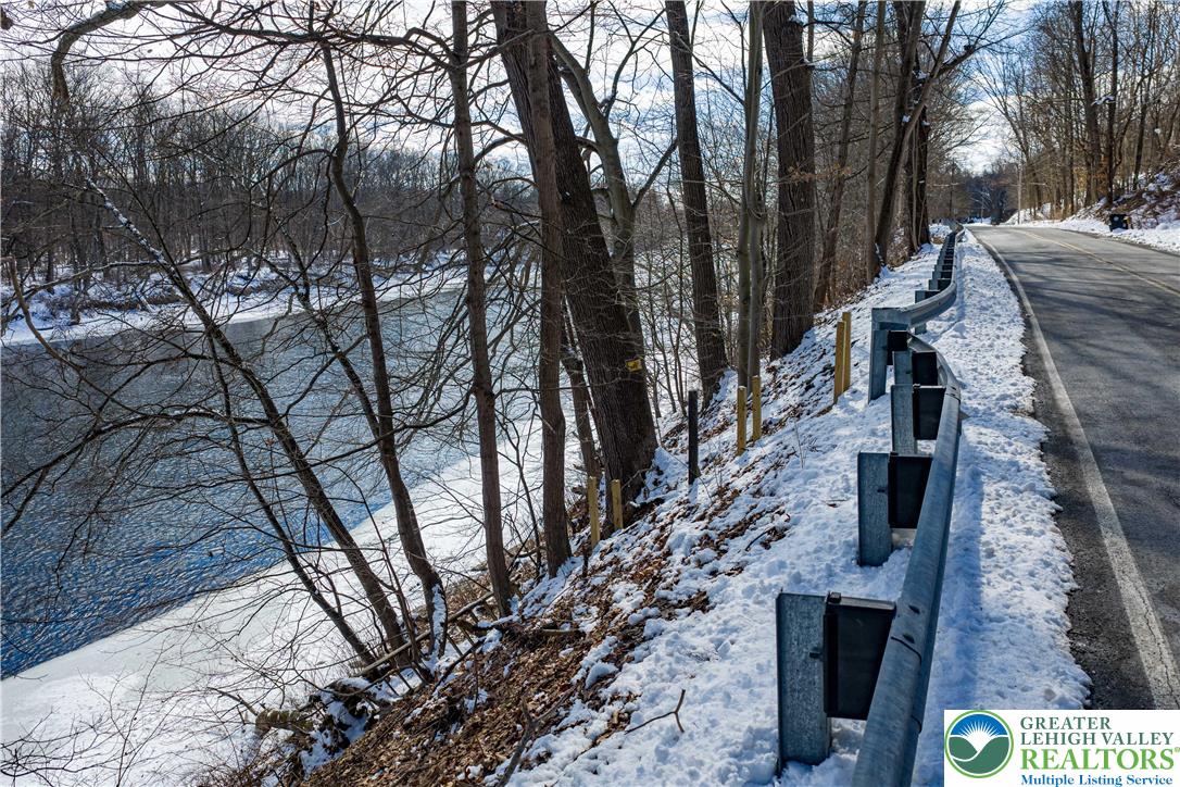 2058 River Road Mount Bethel, PA 18343 - Photo 27 of 39 a backyard of a house with lots of trees
