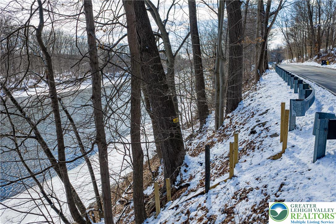 2058 River Road Mount Bethel, PA 18343 - Photo 28 of 39 a view of a yard with large trees