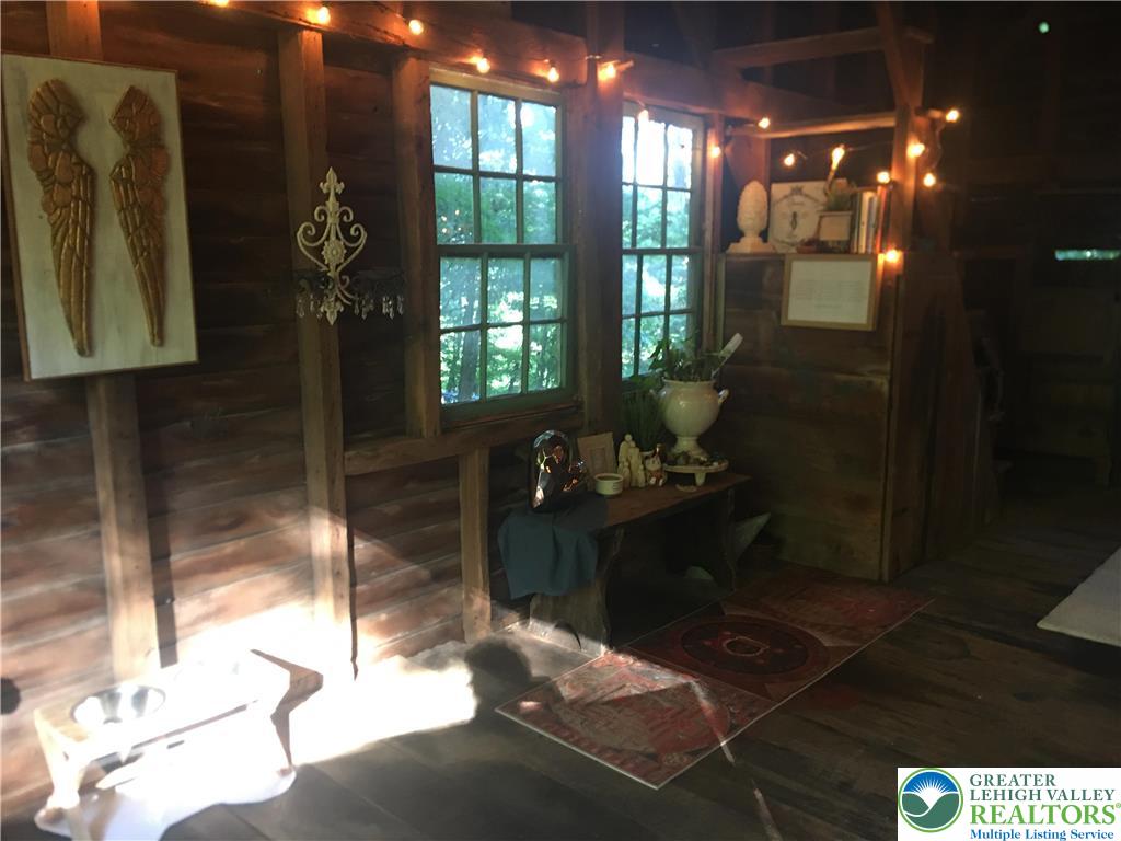 2058 River Road Mount Bethel, PA 18343 - Photo 34 of 39 a living room with furniture and a floor to ceiling window