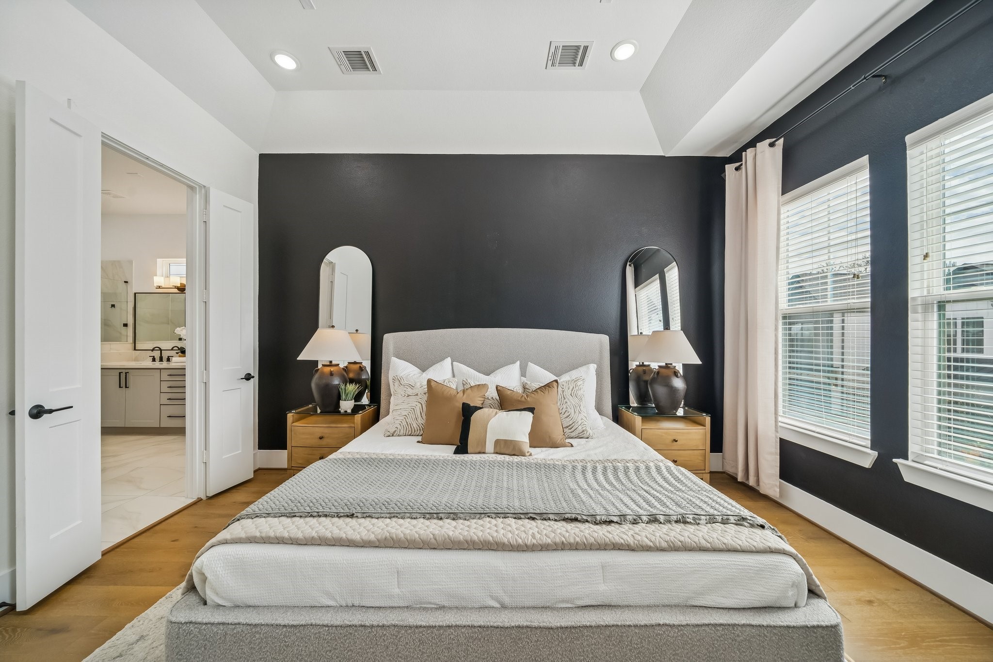 9010 Wellspring Drive Houston, TX 77080 - Photo 12 of 19 a bedroom with a large bed and a large window