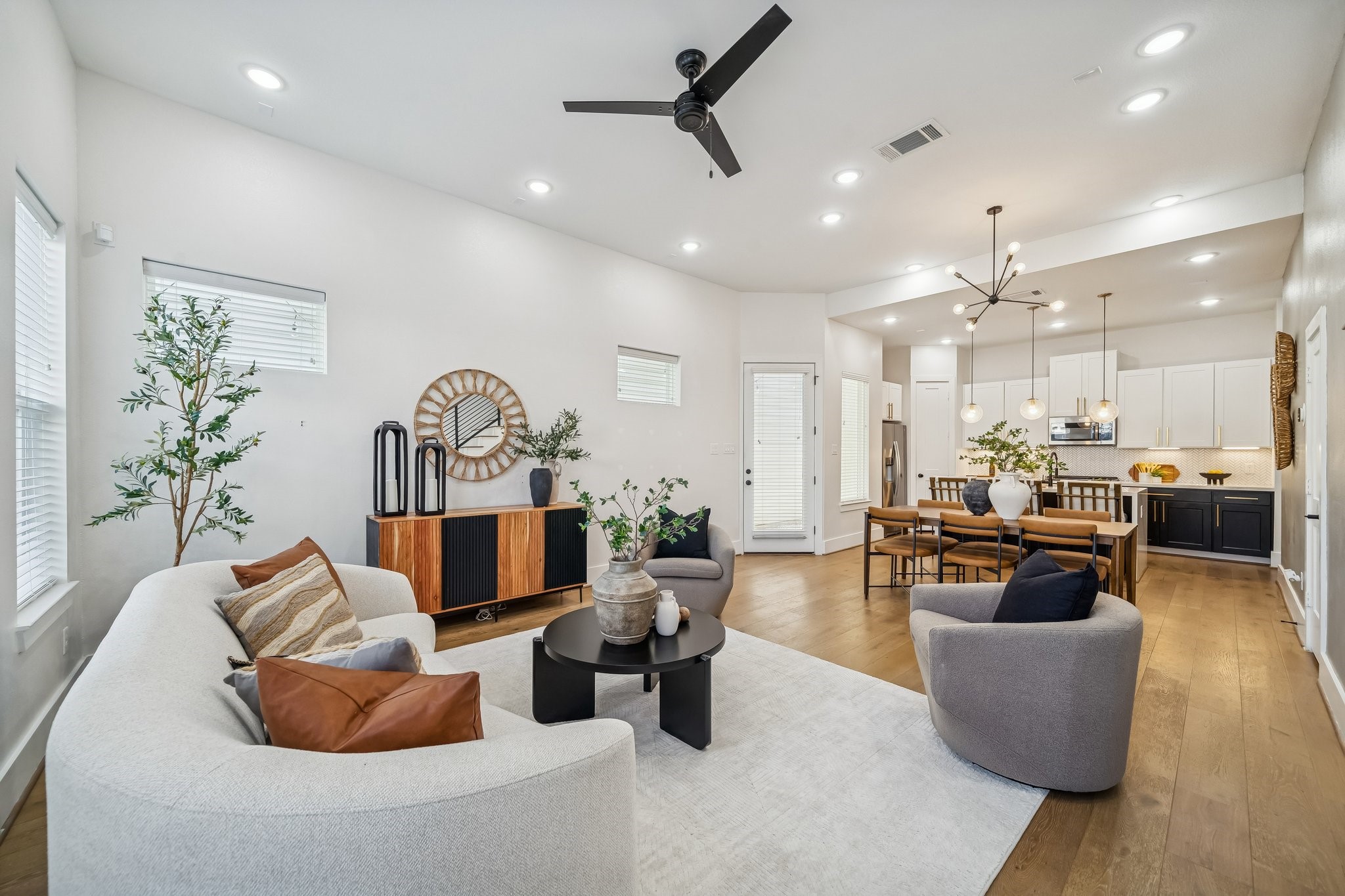 9010 Wellspring Drive Houston, TX 77080 - Photo 5 of 19 a living room with furniture kitchen view and a chandelier