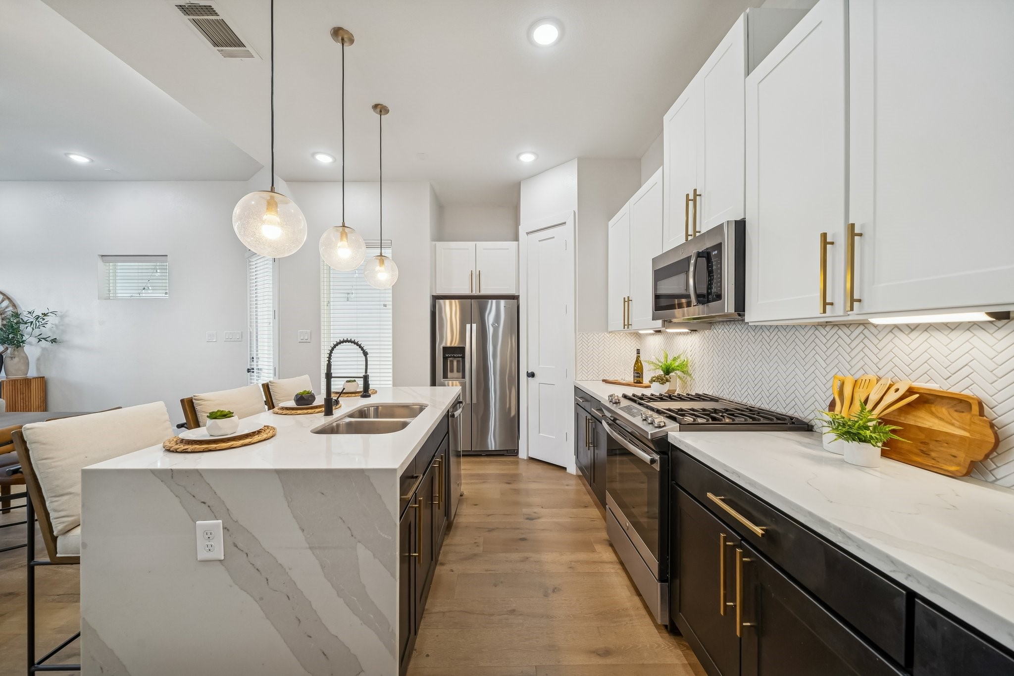 9010 Wellspring Drive Houston, TX 77080 - Photo 7 of 19 a kitchen with stainless steel appliances granite countertop a sink a stove oven a counter top space and cabinets