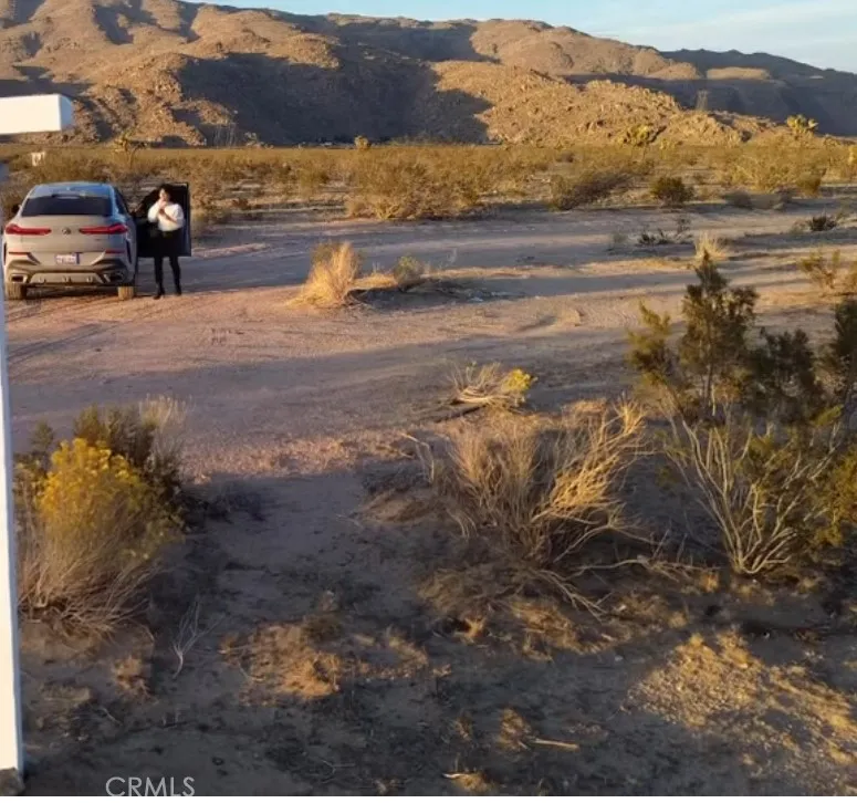 11 Canyon View Road Apple Valley, CA 92308 - Photo 1 of 1 a view of a street with a houses