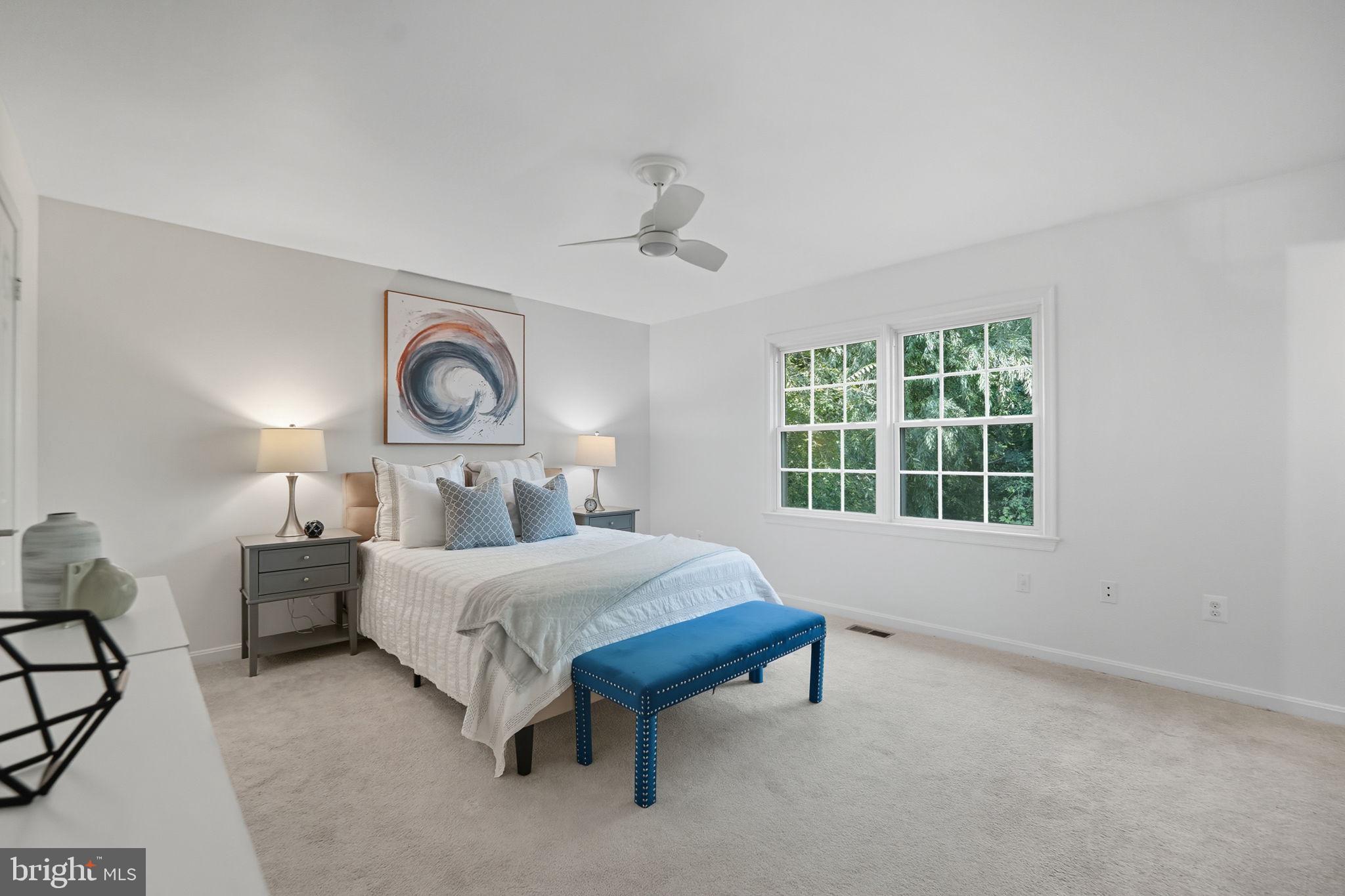 10196 Red Spruce Road Fairfax, VA 22032 - Photo 15 of 36 a bedroom with a bed and window