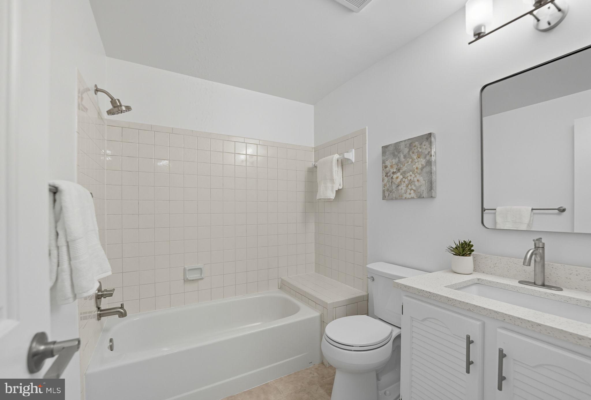 10196 Red Spruce Road Fairfax, VA 22032 - Photo 28 of 36 a bathroom with a sink a toilet and a bathtub