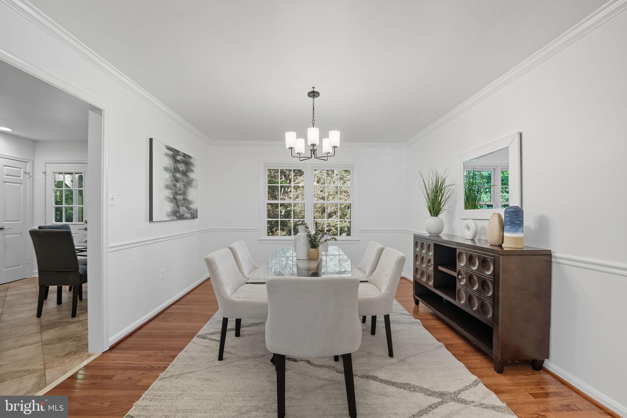 10196 Red Spruce Road Fairfax, VA 22032 - Photo 10 of 36 a view of a dining room with furniture window and wooden floor