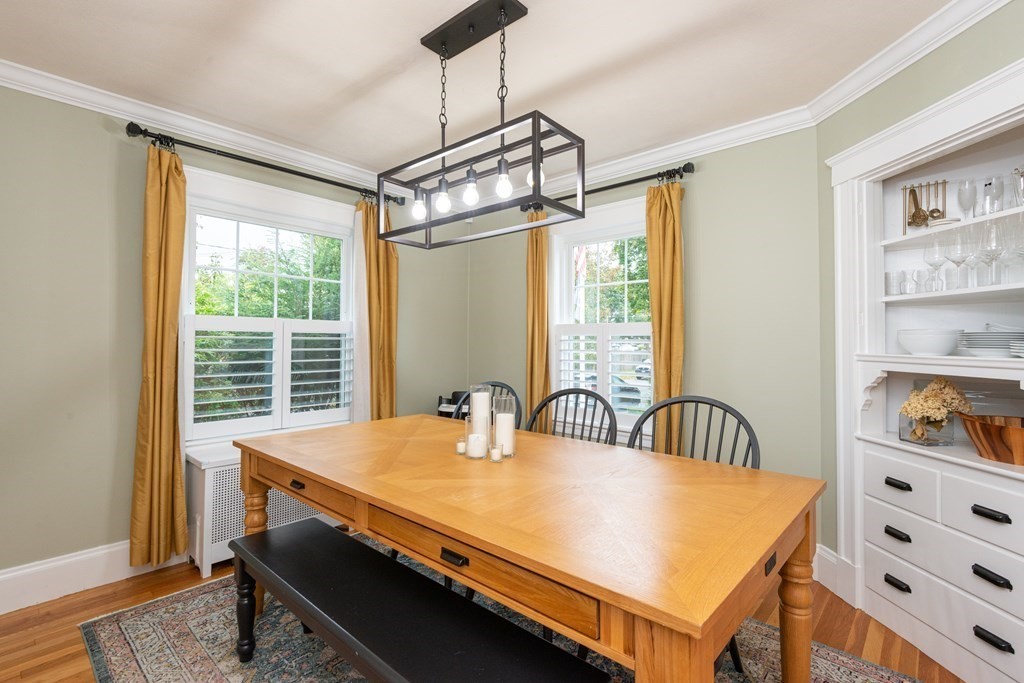 23 Trask Street Danvers, MA 01923 - Photo 13 of 42 a dining room with a large window table and chairs